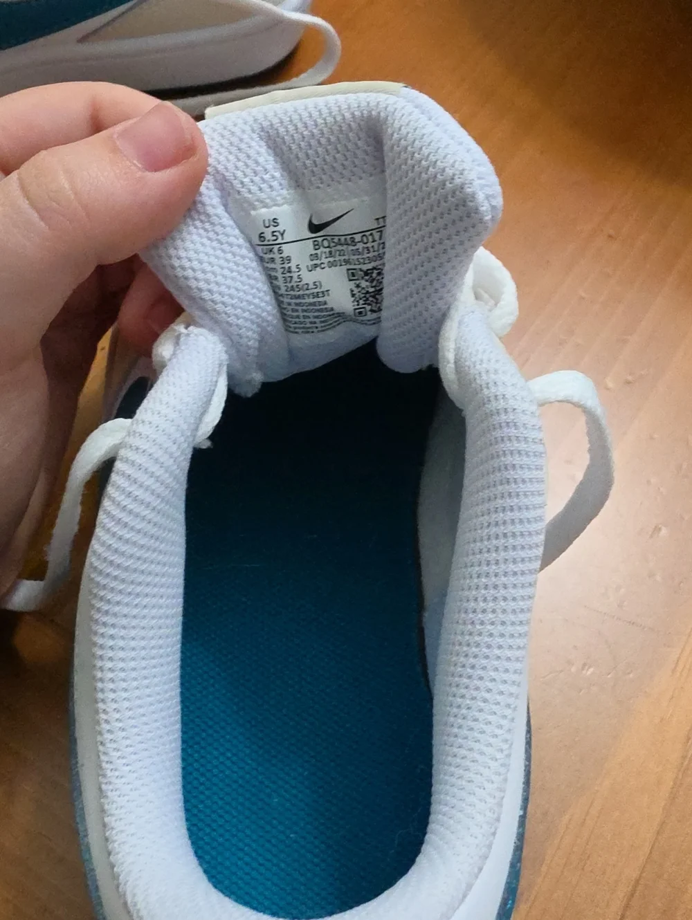 Nike Kids White Sneakers with Teal Swoosh